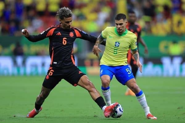 Bruno Guimaraes of Brazil and Richard Rios of Colombia battle for the ball during the South American FIFA World Cup 2026 Qualifier match between Brazil and Colombia at Mane Garrincha Stadium on March 20, 2025 in Brasilia, Brazil. (Photo by Buda Mendes/Getty Images)