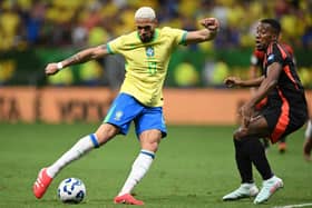 Brazil's midfielder #17 Joelinton and Colombia's defender #02 Carlos Cuesta fight for the ball during the 2026 FIFA World Cup South American qualifiers football match between Brazil and Colombia, at the Mane Garrincha stadium in Brasilia, on March 20, 2025. (Photo by EVARISTO SA / AFP) 