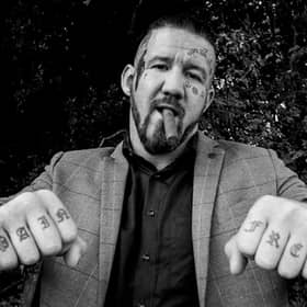 Bare knuckle fighter poses for photograph