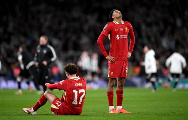 Jarell Quansah and Curtis Jones of Liverpool look dejected after the team's defeat in the Carabao Cup Final between Liverpool and Newcastle United at Wembley Stadium on March 16, 2025 in London, England. (Photo by Justin Setterfield/Getty Images)