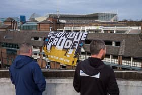 Flags hang from buildings ahead of Newcastle United Football Club's open-top bus victory parade celebrations following their success in the Carabao Cup on March 29, 2025 in Newcastle upon Tyne, England. Newcastle United defeated Liverpool in the Carabao Cup Final to end their seventy-year domestic trophy drought. (Photo by Ian Forsyth/Getty Images)