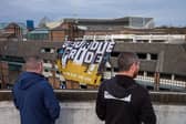 Flags hang from buildings ahead of Newcastle United Football Club's open-top bus victory parade celebrations following their success in the Carabao Cup on March 29, 2025 in Newcastle upon Tyne, England. Newcastle United defeated Liverpool in the Carabao Cup Final to end their seventy-year domestic trophy drought. (Photo by Ian Forsyth/Getty Images)