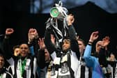 Callum Wilson lifts the Carabao Cup at St James’ Park after playing his part in Newcastle United’s 2-1 win over Liverpool at Wembley on March 16.