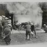 Newcastle was the first place to open a school for air raid patrol instructors.
Here are firefighters watching fellow instructors handling a staged room fire caused by incendiary bombs, at the Newcastle ARP in May 1939. 
(Photo by Fox Photos/Hulton Archive/Getty Images)