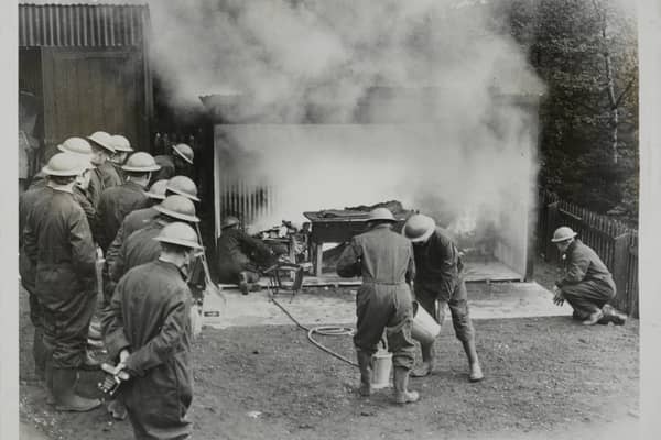 Newcastle was the first place to open a school for air raid patrol instructors.
Here are firefighters watching fellow instructors handling a staged room fire caused by incendiary bombs, at the Newcastle ARP in May 1939. 
(Photo by Fox Photos/Hulton Archive/Getty Images)