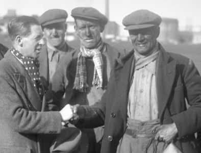 Harry gets a handshake in 1936 as he gets the news that he is going to referee the FA Cup Final.