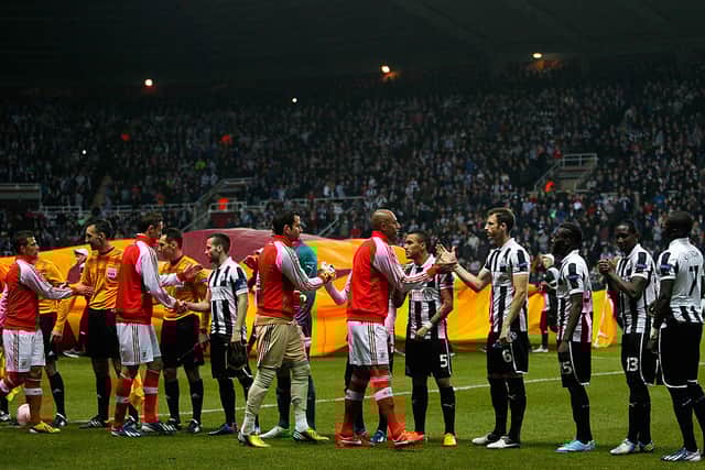 Players shake hands before during the UEFA Europa League quarter final second leg match between Newcastle United and SL Benfica at St James' Park on April 11, 2013 in Newcastle upon Tyne, England. (Photo by Paul Thomas/Getty Images)