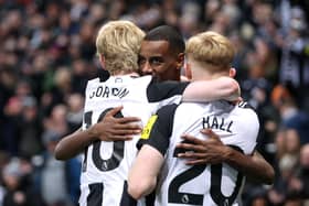 Alexander Isak of Newcastle United celebrates scoring his team's third goal with teammates during the Premier League match between Newcastle United FC and Leicester City FC at St James' Park on December 14, 2024 in Newcastle upon Tyne, England. (Photo by George Wood/Getty Images)