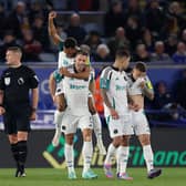 Jacob Murphy of Newcastle United celebrates scoring his team's second goal as he is carried by teammate Fabian Schaer during the Premier League match between Leicester City FC and Newcastle United FC at The King Power Stadium on April 07, 2025 in Leicester, England. (Photo by Carl Recine/Getty Images)