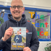 Pets2impress owner Tim Jackson holding his sixth book.