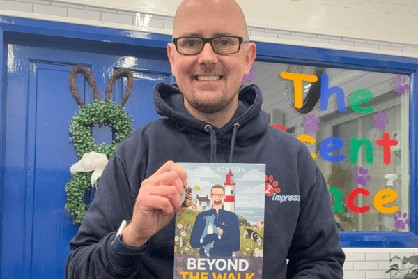 Pets2impress owner Tim Jackson holding his sixth book.