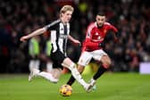 Anthony Gordon (left) in action against Manchester United earlier this season