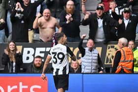 Newcastle United's Brazilian midfielder #39 Bruno Guimaraes celebrates in front of fans after scoring their fourth goal during the English Premier League football match between Newcastle United and Manchester United at St James' Park in Newcastle-upon-Tyne, north east England on April 13, 2025. (Photo by ANDY BUCHANAN / AFP)