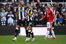 Joelinton is calmed down by Bruno Guimaraes of Newcastle United as the pair leave the field after being substituted during the Premier League match between Newcastle United FC and Manchester United FC at St James' Park on April 13, 2025 in Newcastle upon Tyne, England. (Photo by Stu Forster/Getty Images)