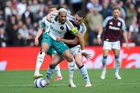 Joelinton of Newcastle United battles for possession with John McGinn of Aston Villa during the Premier League match between Aston Villa FC and Newcastle United FC at Villa Park on April 19, 2025 in Birmingham, England. (Photo by Shaun Botterill/Getty Images)