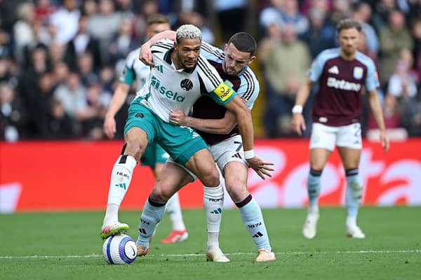 Joelinton of Newcastle United battles for possession with John McGinn of Aston Villa during the Premier League match between Aston Villa FC and Newcastle United FC at Villa Park on April 19, 2025 in Birmingham, England. (Photo by Shaun Botterill/Getty Images)