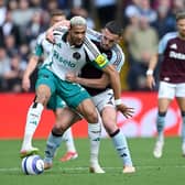 Joelinton of Newcastle United battles for possession with John McGinn of Aston Villa during the Premier League match between Aston Villa FC and Newcastle United FC at Villa Park on April 19, 2025 in Birmingham, England. (Photo by Shaun Botterill/Getty Images)