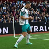 Newcastle United's Swiss defender #05 Fabian Schar celebrates  after scoring their first goal during the English Premier League football match between Aston Villa and Newcastle United at Villa Park in Birmingham, central England on April 19, 2025. (Photo by Darren Staples / AFP)