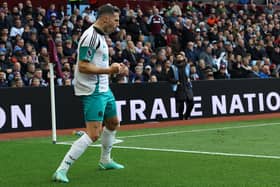 Newcastle United's Swiss defender #05 Fabian Schar celebrates  after scoring their first goal during the English Premier League football match between Aston Villa and Newcastle United at Villa Park in Birmingham, central England on April 19, 2025. (Photo by Darren Staples / AFP)