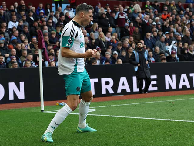 Newcastle United's Swiss defender #05 Fabian Schar celebrates  after scoring their first goal during the English Premier League football match between Aston Villa and Newcastle United at Villa Park in Birmingham, central England on April 19, 2025. (Photo by Darren Staples / AFP)