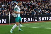Newcastle United's Swiss defender #05 Fabian Schar celebrates  after scoring their first goal during the English Premier League football match between Aston Villa and Newcastle United at Villa Park in Birmingham, central England on April 19, 2025. (Photo by Darren Staples / AFP)