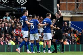 Ipswich Town defender Leif David being shown a straight red card