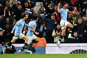 Manchester City's Portuguese midfielder #27 Matheus Nunes (R) celebrates after scoring his team second goal during the English Premier League football match between Manchester City and Aston Villa at the Etihad Stadium in Manchester, north west England, on April 22, 2025. (Photo by Oli SCARFF / AFP) /      