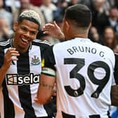 Newcastle United's Danish striker William Osula celebrates scoring the team's third goal with Brazilian midfielder Bruno Guimaraes (C) and defender Kieran Trippier during the English Premier League football match between Newcastle United and Ipswich Town at St James' Park.