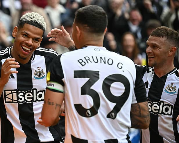 Newcastle United's Danish striker William Osula celebrates scoring the team's third goal with Brazilian midfielder Bruno Guimaraes (C) and defender Kieran Trippier during the English Premier League football match between Newcastle United and Ipswich Town at St James' Park.