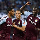 Marcus Rashford of Aston Villa celebrates scoring his team's first goal with Youri Tielemans and Amadou Onana during the Premier League match between Manchester City FC and Aston Villa FC at Etihad Stadium on April 22, 2025 in Manchester, England. (Photo by Carl Recine/Getty Images)