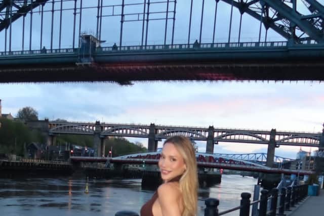 Newcastle United WAG Ana Lidia Martins poses on the city Quayside with the world famous Tyne Bridge, and the Tyne's other crossings, behind her. The picture was taken by her husband, Bruno Guimaraes.