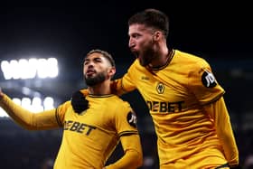 Matt Doherty of Wolverhampton Wanderers celebrates after scoring his team's first goal with Matheus Cunha during the Premier League match between Chelsea FC and Wolverhampton Wanderers FC at Stamford Bridge on January 20, 2025 in London, England. (Photo by Jack Thomas - WWFC/Wolves via Getty Images)