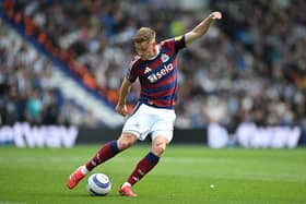 Harvey Barnes of Newcastle United has a shot during the Premier League match between Brighton & Hove Albion FC and Newcastle United FC at Amex Stadium on May 04, 2025 in Brighton, England.