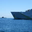 A “secret weapon” is being developed and could be used by Royal Navy technicians to search for Russian submarines. Pictured: HMS Tyne with Russian Kilo-class submarine Krasnodar in the background.