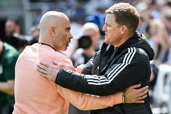 Chelsea's Italian head coach Enzo Maresca (L) and Newcastle United's English head coach Eddie Howe (R) hugh each other at the start of the English Premier League football match between Newcastle United and Chelsea at St James' Park in Newcastle-upon-Tyne, north east England on May 11, 2025. (Photo by ANDY BUCHANAN / AFP) /