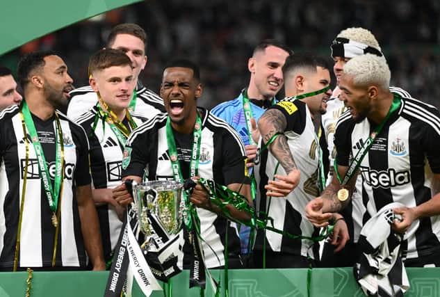Newcastle United player Alexander Isak celebrates with the trophy after the Carabao Cup Final between Liverpool and Newcastle United at Wembley Stadium on March 16, 2025 in London, England.