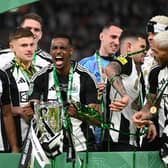 Newcastle United player Alexander Isak celebrates with the trophy after the Carabao Cup Final between Liverpool and Newcastle United at Wembley Stadium on March 16, 2025 in London, England.