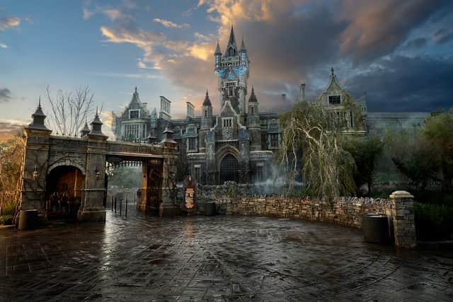The towering silhouette of Frankenstein Manor hides Monsters Unchained: The Frankenstein Experiment - a chilling dark ride featuring classic monsters