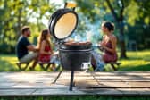 The Kamado-style ceramic BBQ in action – perfect for slow-smoked feasts and summer gatherings.