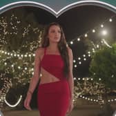 American bombshell Toni entering Love Island villa. 