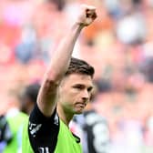 Kieran Tierney of Arsenal acknowlegdes the fans, after his final appearance in the teams 2-1 victory during the Premier League match between Southampton FC and Arsenal FC at St Mary's Stadium on May 25, 2025 in Southampton, England. (Photo by Stuart MacFarlane/Arsenal FC via Getty Images)