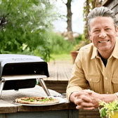 Jamie Oliver with his Tefal gas pizza oven, designed for quick, even-cooked homemade pizzas in the garden