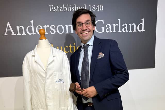 Fred Wyrley-Birch, Director at Anderson and Garland, with the lab coat worn by Diana.