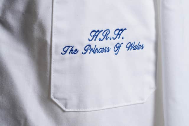 A close-up on the embroidery on the coat.