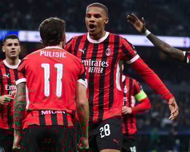 TOPSHOT - AC Milan's German defender #28 Malick Thiaw celebrates scoring their first goal during the UEFA Champions League, league phase day 4 football match between Real Madrid CF and AC Milan at the Santiago Bernabeu stadium in Madrid on November 5, 2024. (Photo by Pierre-Philippe MARCOU / AFP) 