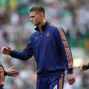 Sven Botman of Newcastle wearing the adidas tracksuit top shakes hands during the pre-season friendly match between Celtic and Newcastle United at Celtic Park on July 19, 2025 in Glasgow, Scotland.