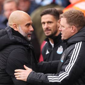 Pep Guardiola, Manager of Manchester City, embraces Eddie Howe, Manager of Newcastle United, prior to the Premier League match between Manchester City FC and Newcastle United FC at Etihad Stadium on February 15, 2025 in Manchester, England. (Photo by Carl Recine/Getty Images)