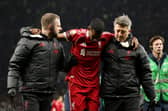 Alexander Isak hobbles off after breaking the deadlock for Liverpool.