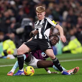 Lewis Hall of Newcastle United is tackled by Lesley Ugochukwu of Burnley during the Premier League match between Burnley and Newcastle United at Turf Moor on December 30, 2025 in Burnley, England. (Photo by Stu Forster/Getty Images)