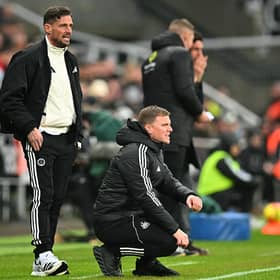 Newcastle United's English head coach Eddie Howe (C) and Newcastle United's assistant coach Jason Tindall (L) look on during the English Premier League football match between Newcastle United and Brentford  at St James' Park in Newcastle-upon-Tyne, north east England on February 7, 2026. (Photo by ANDY BUCHANAN / AFP via Getty Images) 